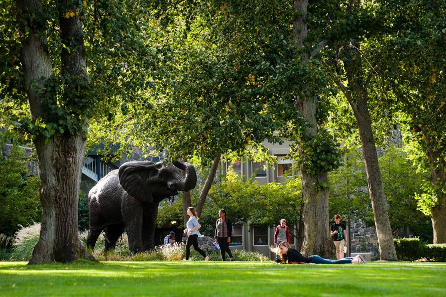 09/21/2015 - Medford/Somerville, Mass. - A view of the new Jumbo statue on the Academic Quad  with students walking to and from class photographed on September 16, 2015. (Alonso Nichols/Tufts University)